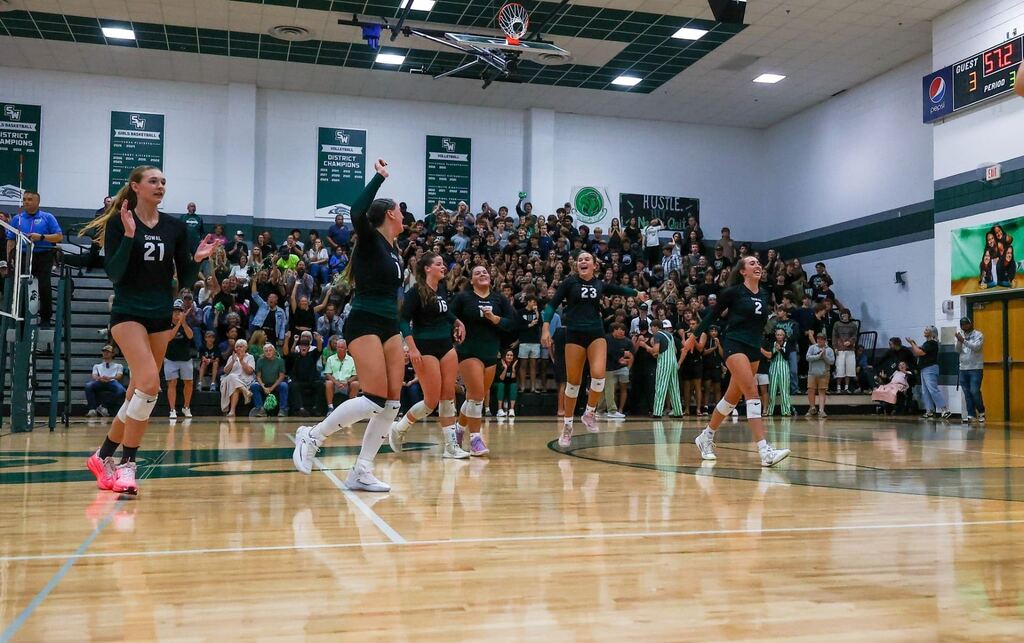 South Walton Seahawks volleyball team celebrating on the court